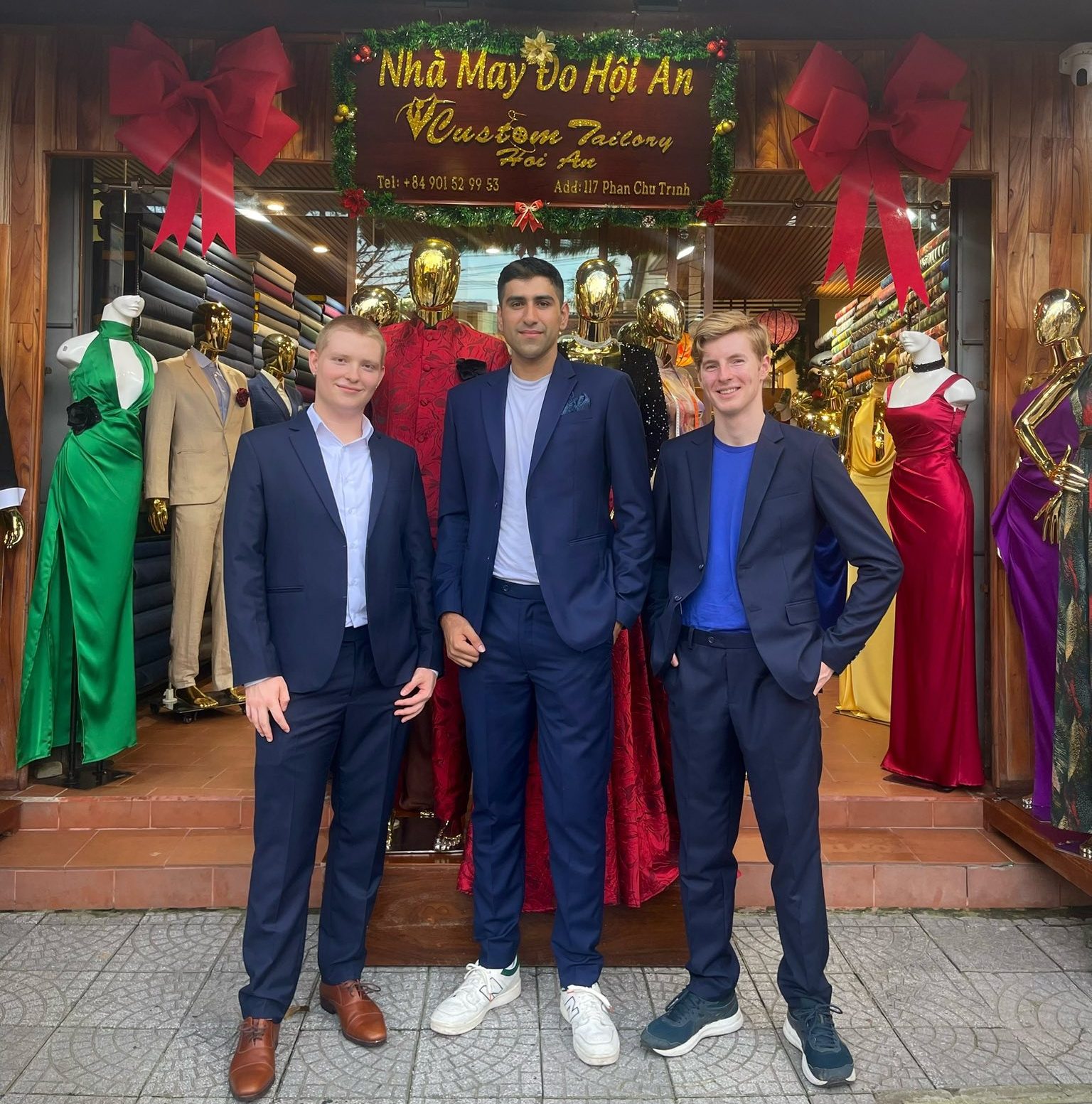 Customers wearing vest designs by Hoi An tailor