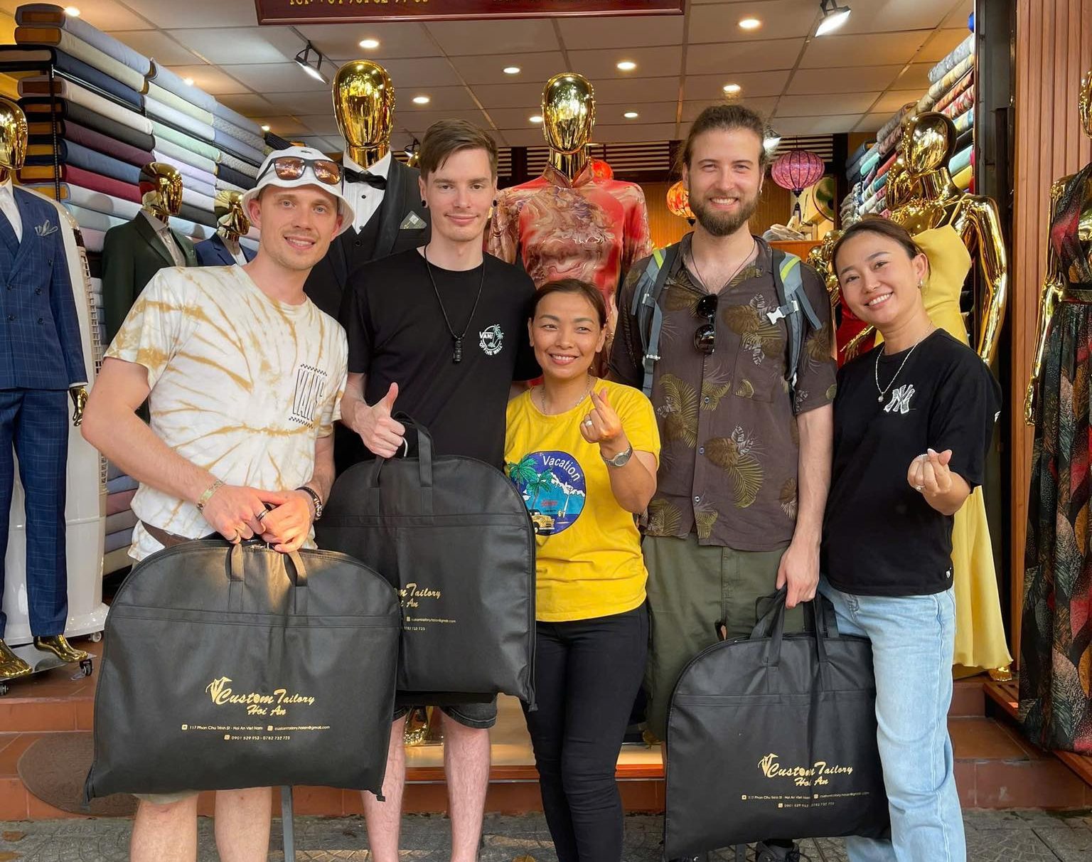 Customers receive their products when choosing custom coat tailor Hoi An
