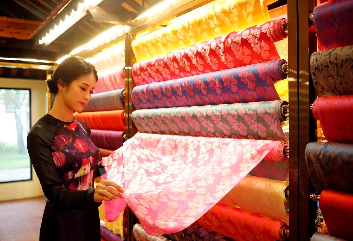 Custom coat tailor Hoi An with signature silk from traditional craft villages